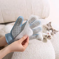 Pet grooming glove removing loose fur from a cat